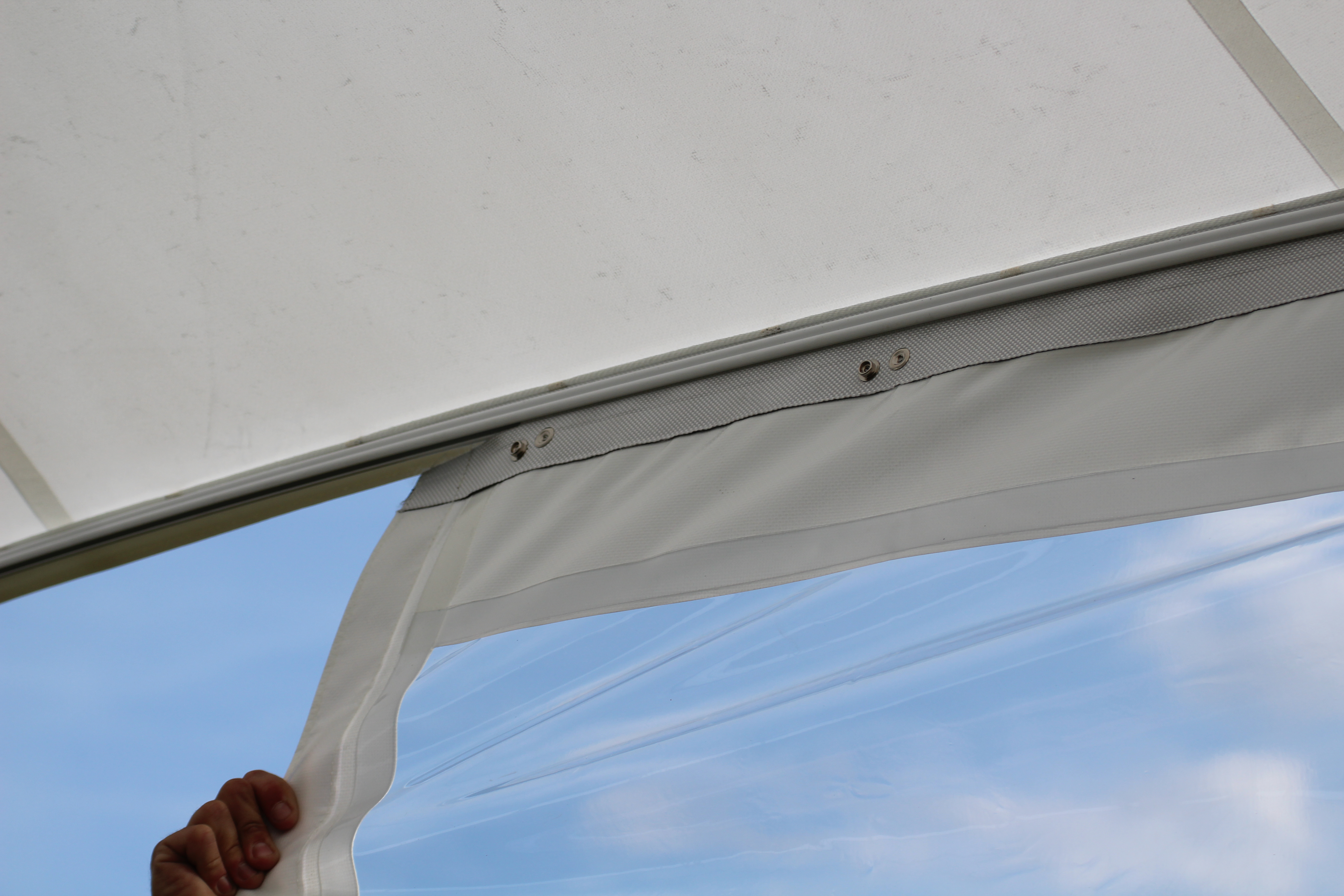 Sailcloth rail for sidewall